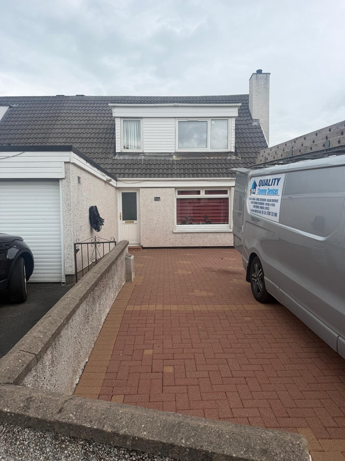 Quality Cleaning Services van at a residential property